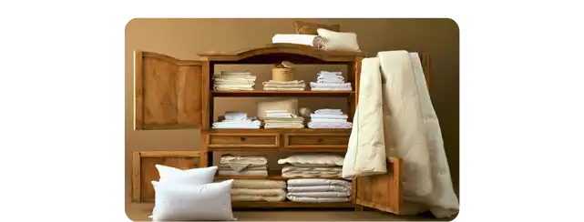 Premium hotel linen set including bedsheets, pillowcases and duvet cover, neatly arranged for a luxury hotel room setting by Hometex Bangladesh